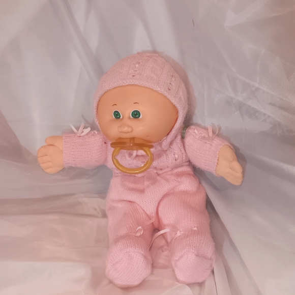 Cabbage patch baby with pasafier 1985 red signature